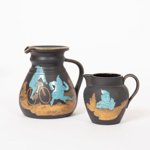 Wedgwood black basalt enamelled “Brownie" jugs c.1915